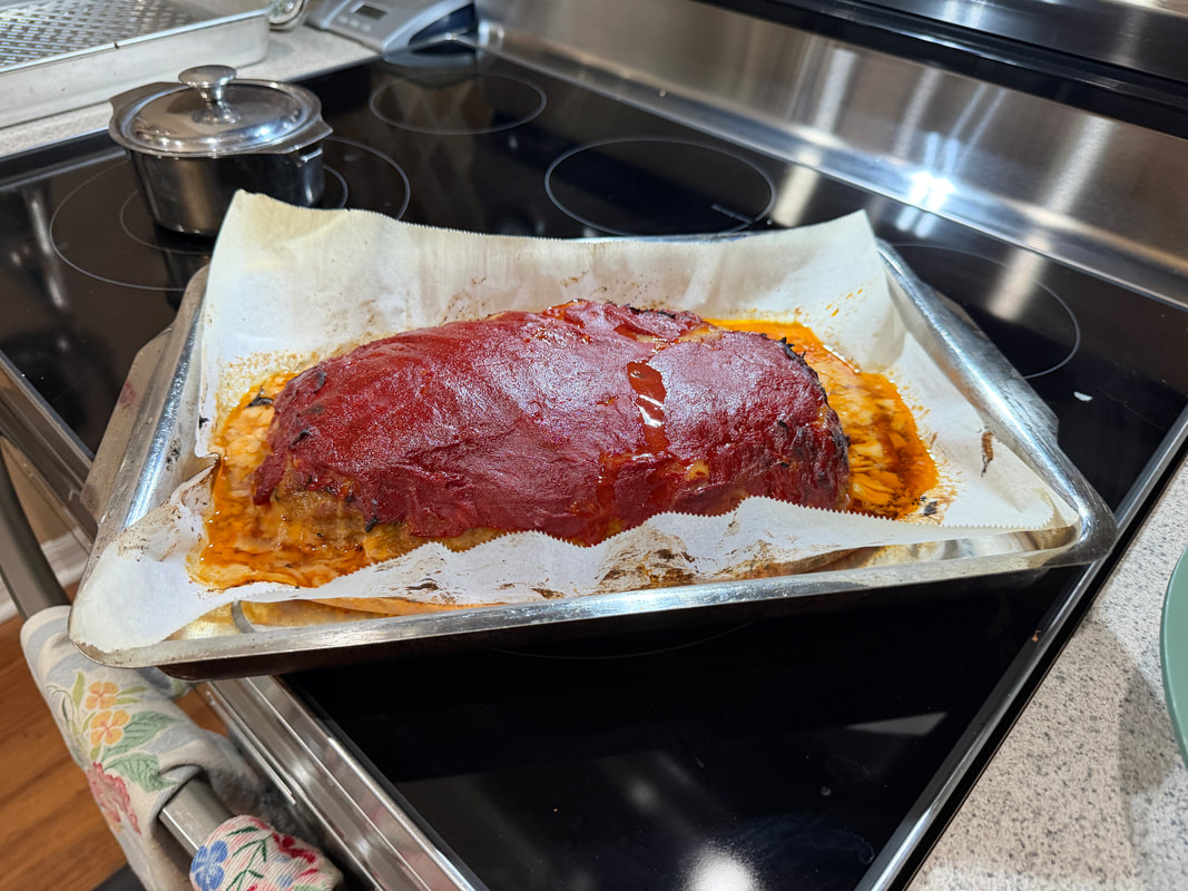Cajun meatloaf served with creamy mashed potatoes