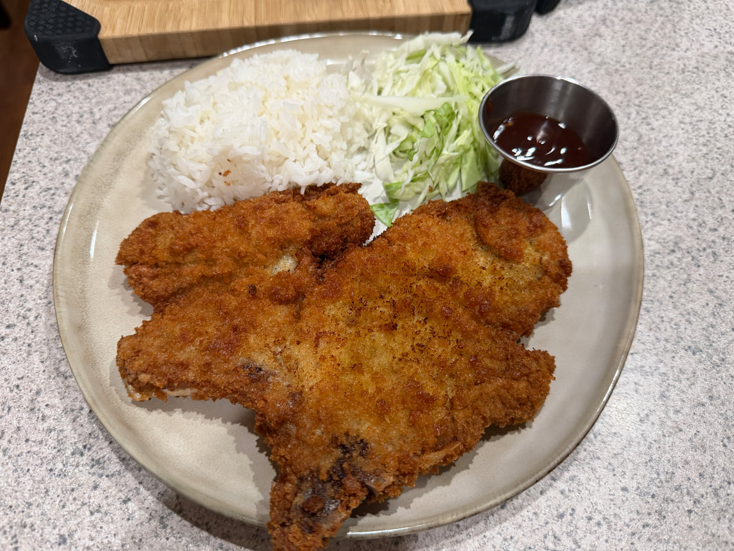 Dianne's Japanese Rosu Katsu with rice, shredded cabbage, and tonkatsu sauce